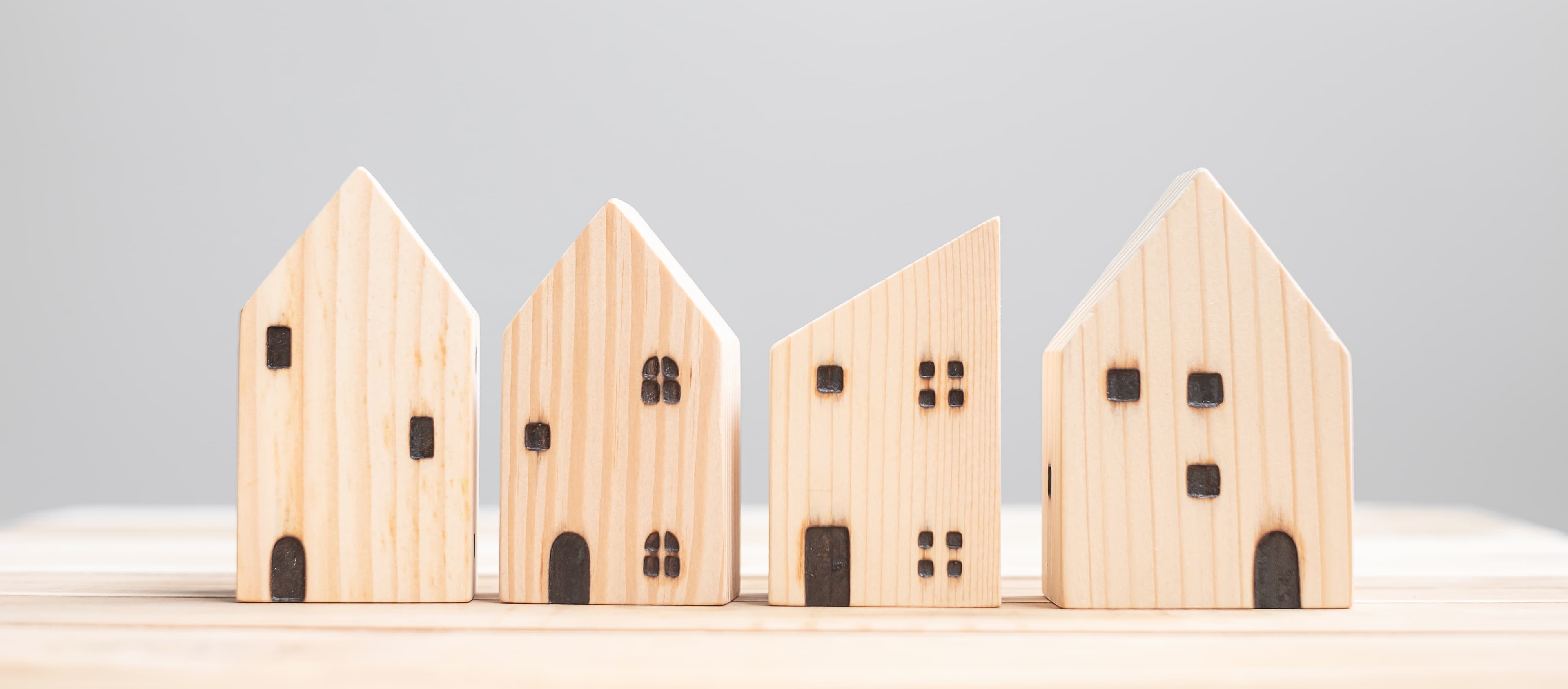 A row of small wooden house models